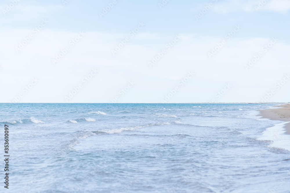 Side of the beach without people, with some small waves to make it beautiful. Side of the beach without people, with some small waves to make it beautiful.