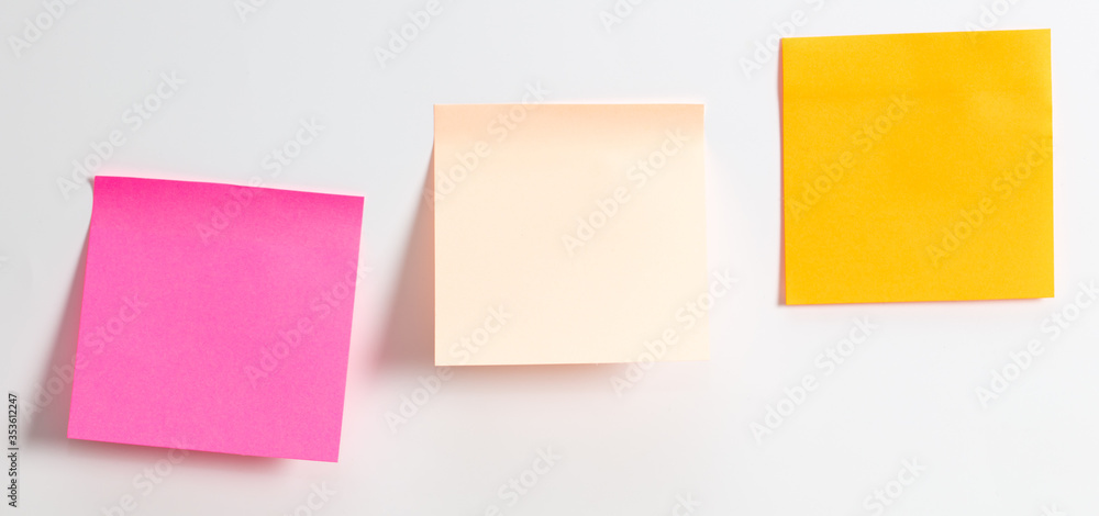 Colored papers hang on a white background. Colored papers hang on a white background.