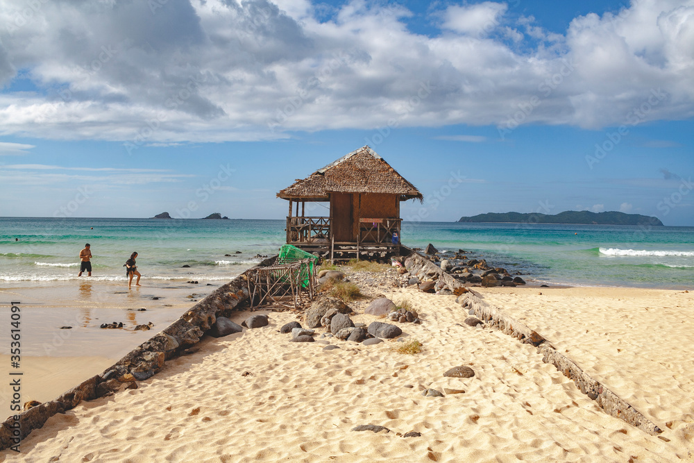 Remote wooden building on the beach of Nacpan, El Nido, Philippines