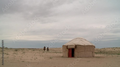 Kazakhstan vast deserts with cattle chasers, wild horses and camels. photo