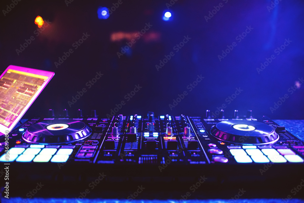 Obraz premium music controller mixer DJ Board at an electronic party