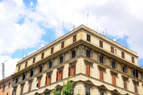 Vintage buildings with many windows and antennas in Rome