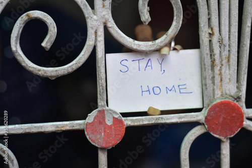 after corona virus lockdown every indian people is quarantine and girl wright lockdown in a paper and showing in the window, stay home, stay safe, life during lockdown   photo