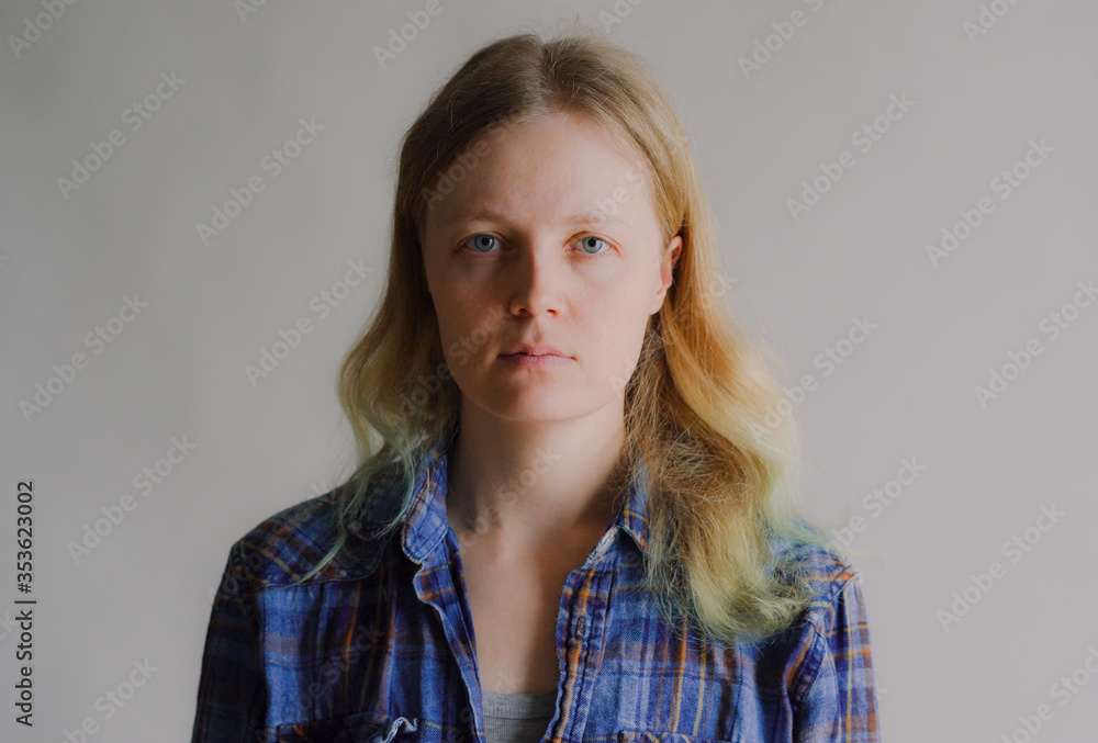 portrait of a simple serious woman without makeup portrait of a simple serious woman without makeup