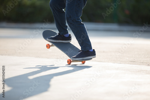 Skateboarder skateboarding at morning outdoors