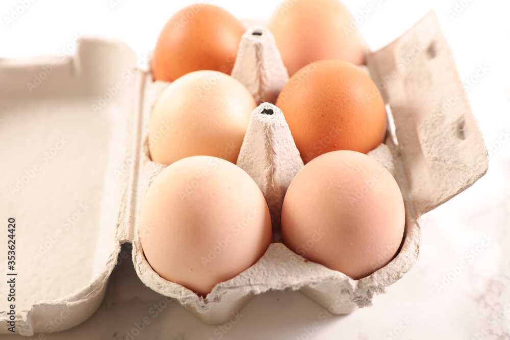egg in box on white background egg in box on white background