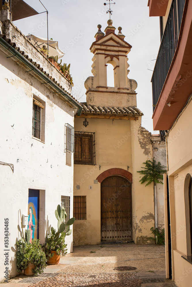 old street in the city of Cordoba with a small church