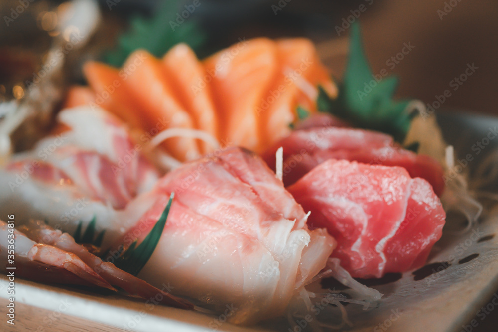 Mixed slices of fresh raw salmon sashimi for dinner. Mixed slices of fresh raw salmon sashimi for dinner.