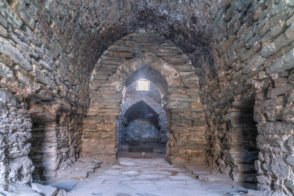 The view of interior in old stone ancient caravanserai in Tash-Rabat in Kyrgyzstan