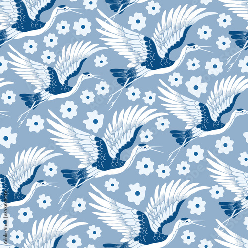 Crane Birds Flying with Flowers Vector Seamless Pattern
