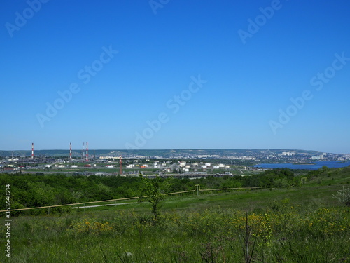 Oil refinery and petrochemical architecture plant industrial with blue sky background, White oil and gas refinery tank, Oil refinery plant from industry zone business power and energy petroleum.