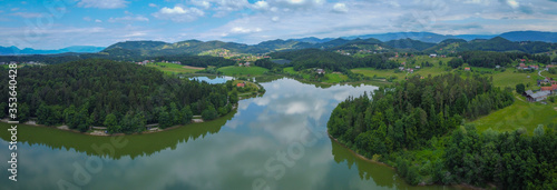 Vászonkép Aerial drone photo of Smartinsko jezero or Smartinsko lake with visible fishing stands and mountains in the background