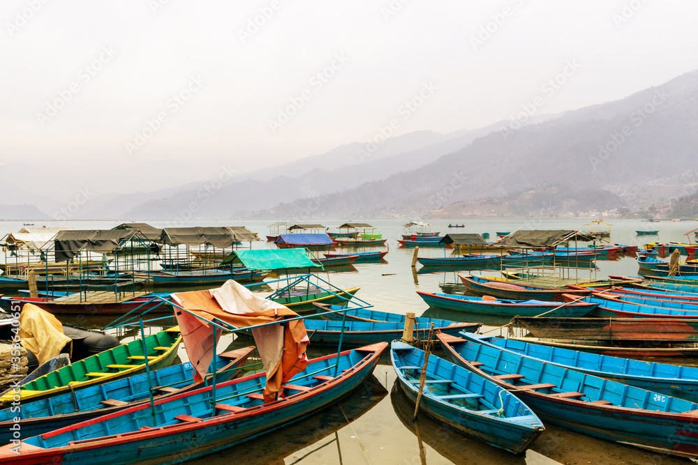 Colorful wooden boats in Phewa Lake, Pokhara, Nepal
