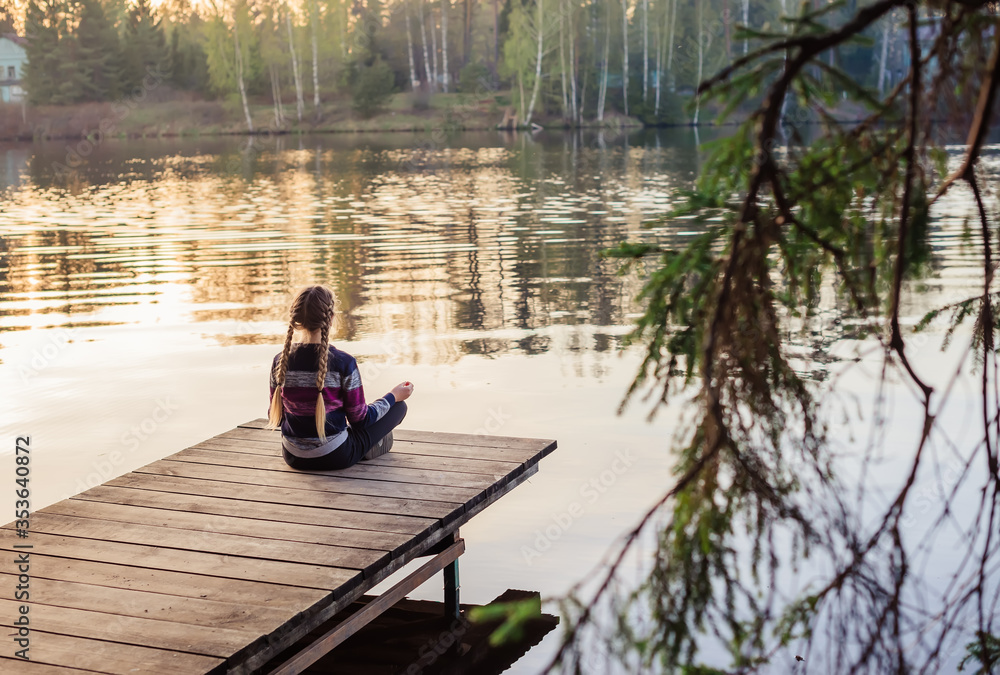 young woman sitting on a boat young woman sitting on a boat