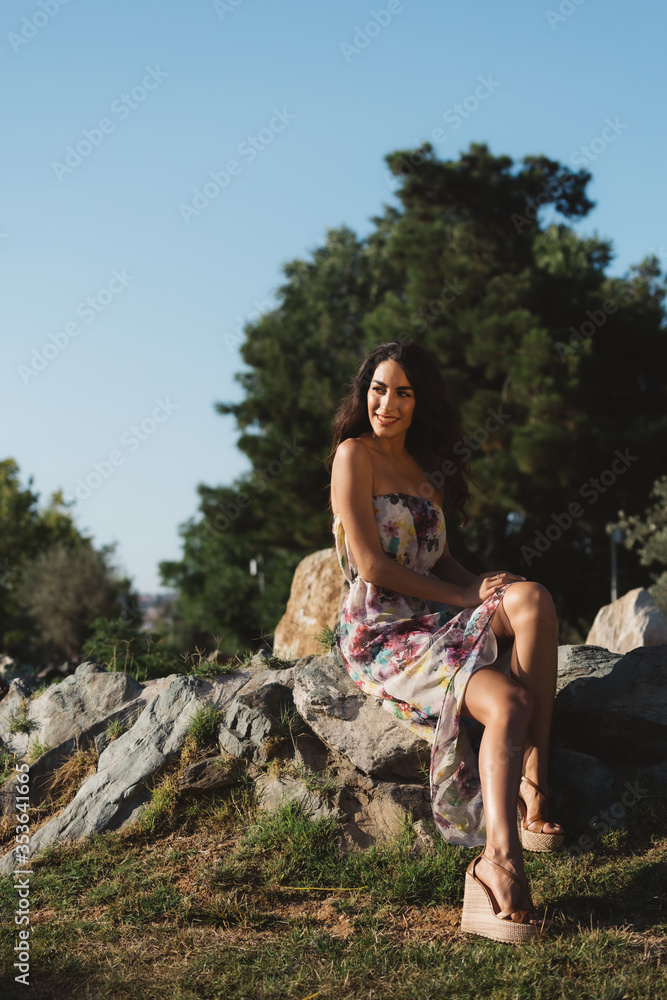 Girl in a dress posing in motion on a street background Girl in a dress posing in motion on a street background