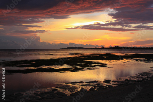 Scenic sunset at Pundewa beach islands silhouette