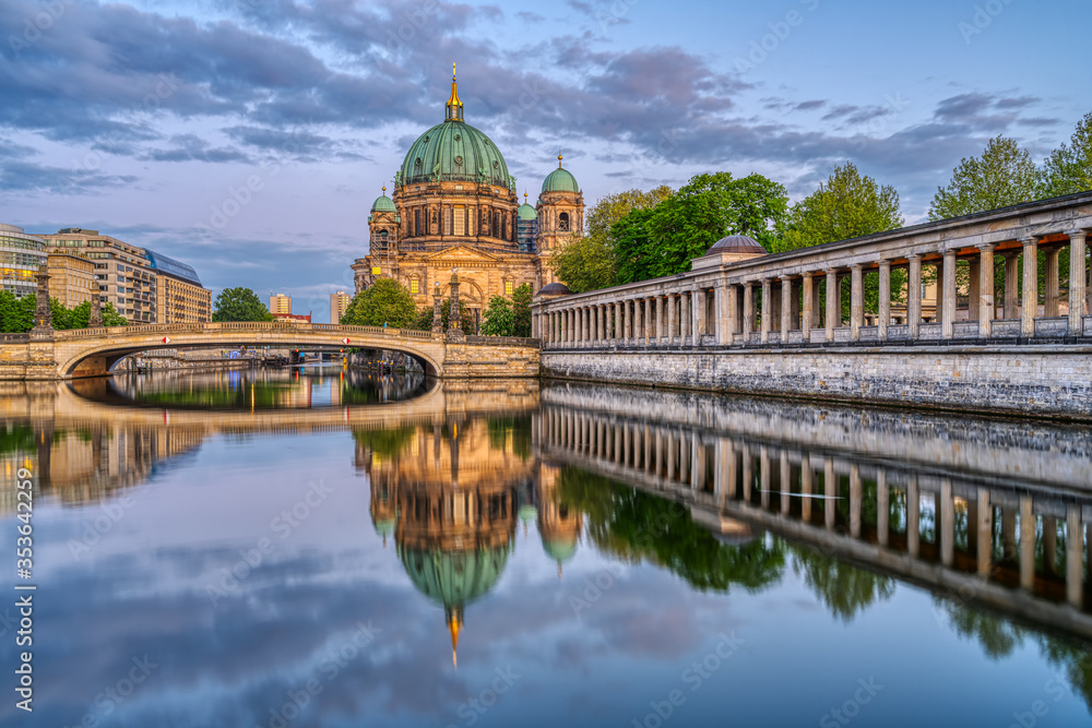The Berlin Cathedral at dusk with a reflection in the river Spree