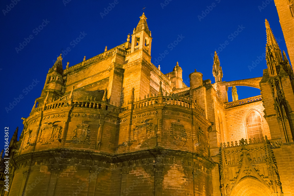 Night view of the spiers of the gothic cathedral of Seville, Spain.