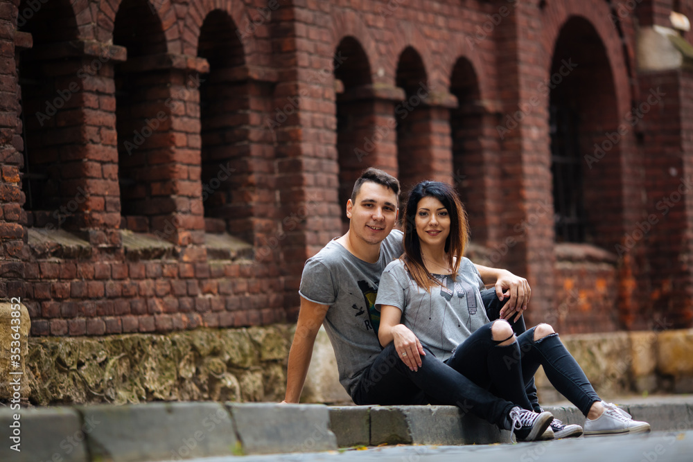young couple posing on city background, travel concept