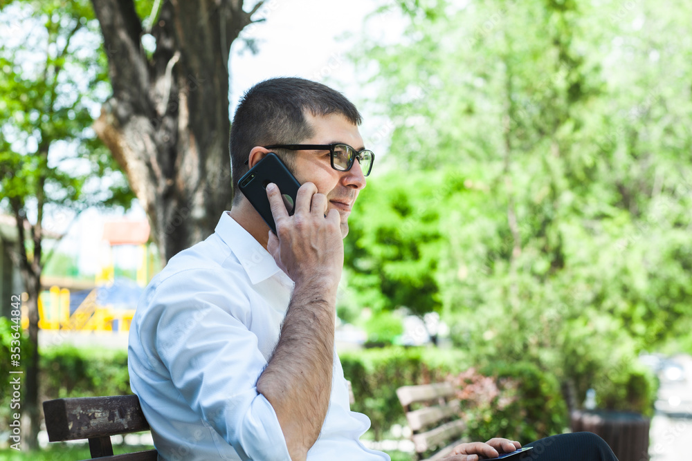 happy smiling businessman working with cell phone, outdoors happy smiling businessman working with cell phone, outdoors
