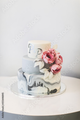 Cake with artificial flowers on it.