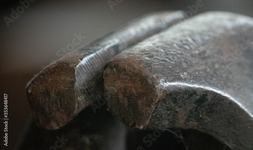 A close-up picture of the well worn steel jaws of an old vice depicting strength and power.