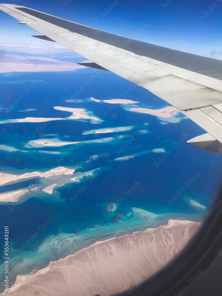 Obraz premium Ariel view of Red Sea which located in Egypt with beauty of nature and landscape from airplane window as travel concept and adventure memory card from vacation mobile photography in winter period