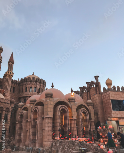Mobile photography of muslim building with small candles on the ground, as historic part of church located in Egypt with travel concept from vacation in exotic country and culture landmark wallpaper 