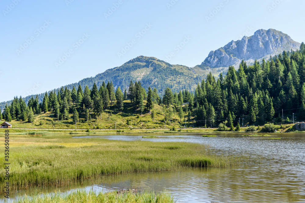 Panoramic view of the Julian Alps in summer, seen from passo Pramollo on the border between Italy and Austria. Mountain Landscape.