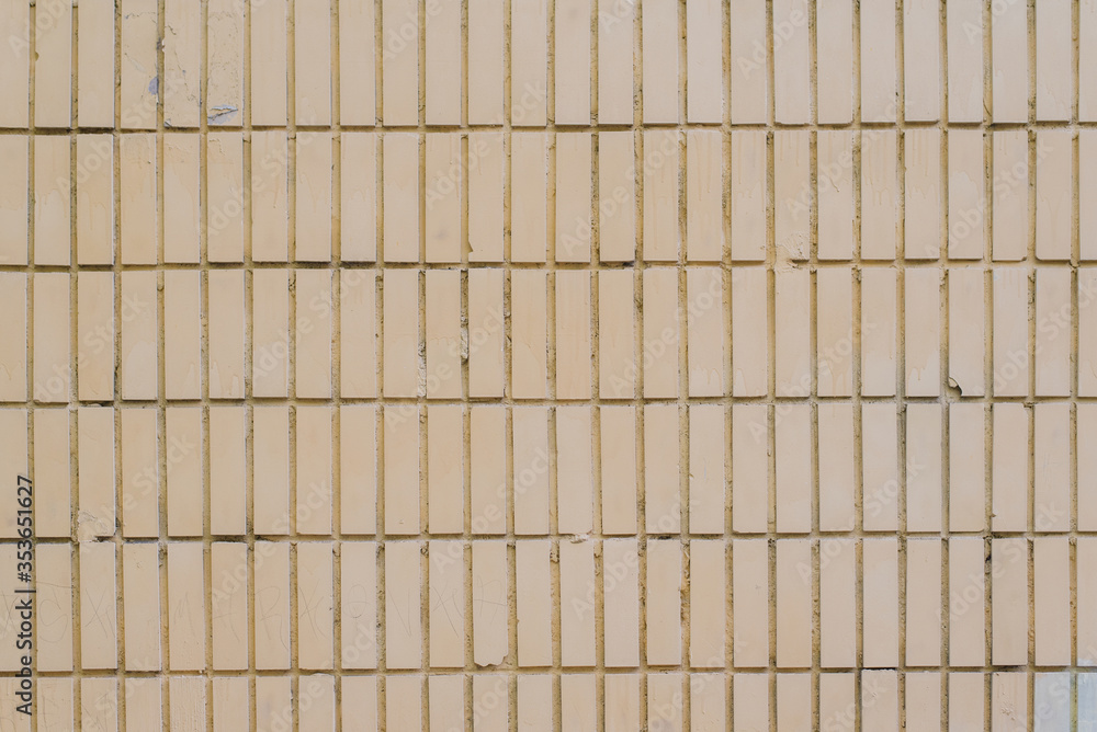 The texture of the walls of smooth brick or smooth tile white and yellow