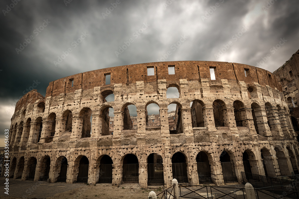 Facade of the Rome Coliseum with cloudy sky. Amphitheatrum Flavium 72 a.D. Latium, Italy, Europe
