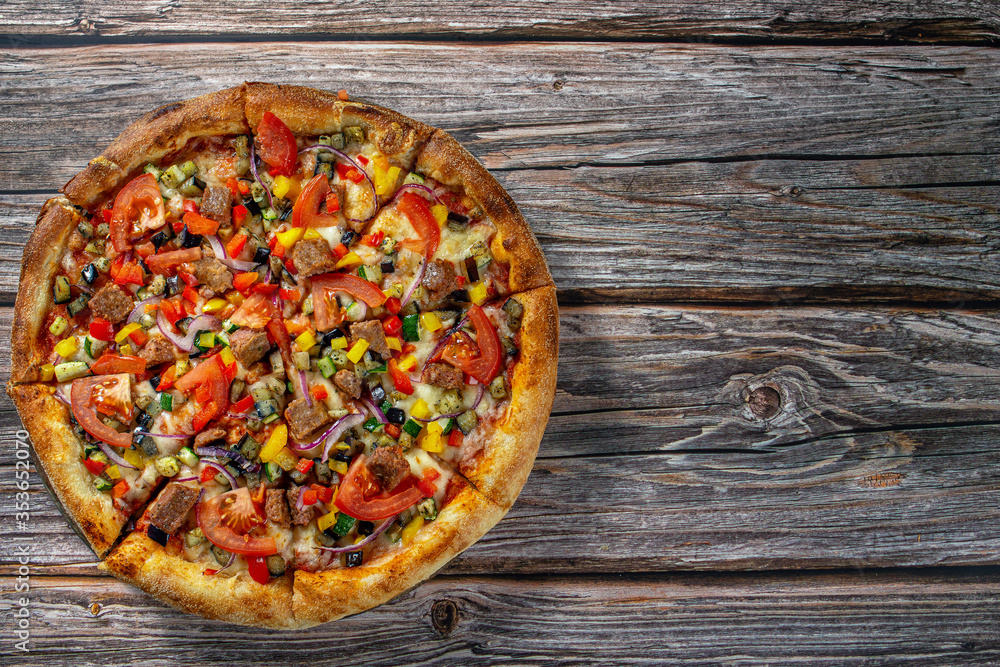 Fresh vegetarian pizza on wooden board