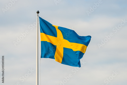 Large swedish flag waving in the breeze.