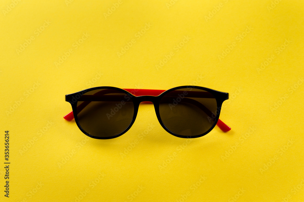 sunglasses on a yellow background sunglasses on a yellow background
