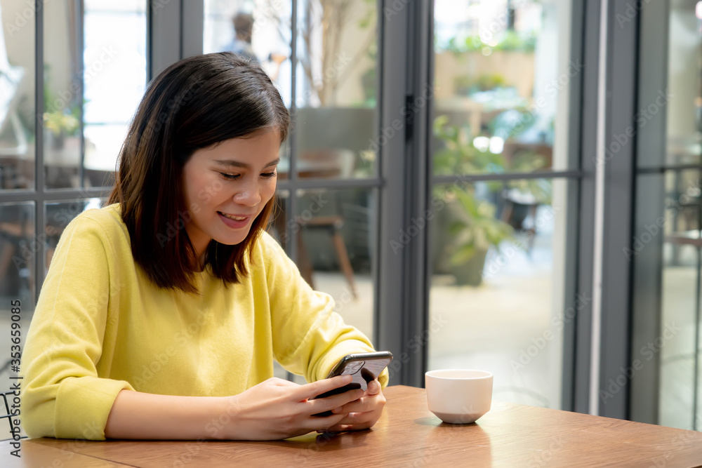 Asian women are using mobile phones to shopping online. Young women use technology to shopping. Asian women are using mobile phones to shopping online. Young women use technology to shopping.