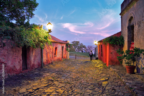 lonely street of Colonia del Sacramento, at twilight, with pink clouds. Uruguay. photo