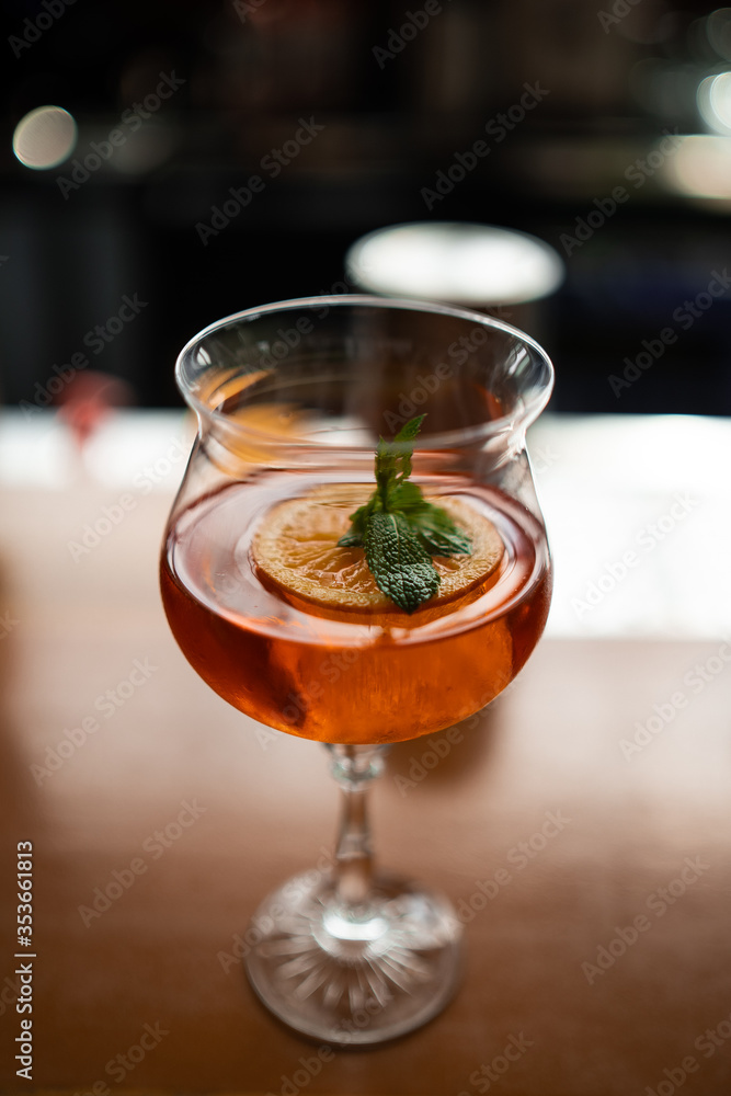 Aperol spritz cocktail in glass on table. italian alcoholic cocktail isolated on wooden background. orange cocktail. Bar menu Aperol spritz cocktail in glass on table. italian alcoholic cocktail isolated on wooden background. orange cocktail. Bar menu