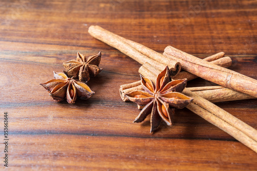 Aromatic cinnamon on dark wooden background