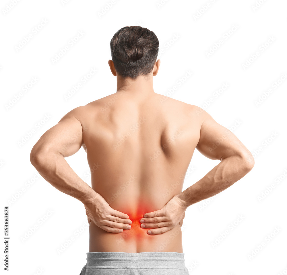 Man suffering from pain in lower back on white background Man suffering from pain in lower back on white background