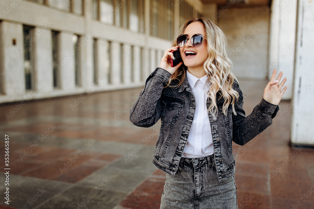 Blonde young woman talking on the phone Blonde young woman talking on the phone