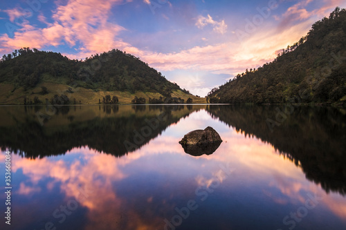 stunning reflection of sunrise over the lake