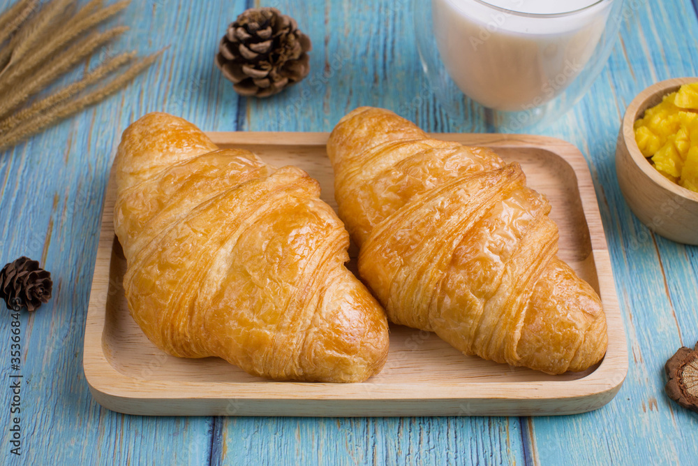 freshly croissants on wooden plate freshly croissants on wooden plate