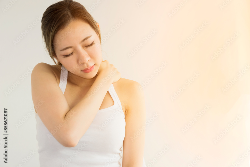 An Asian woman has a migraine headache because she is stressed from working at an office. An Asian woman has a migraine headache because she is stressed from working at an office.