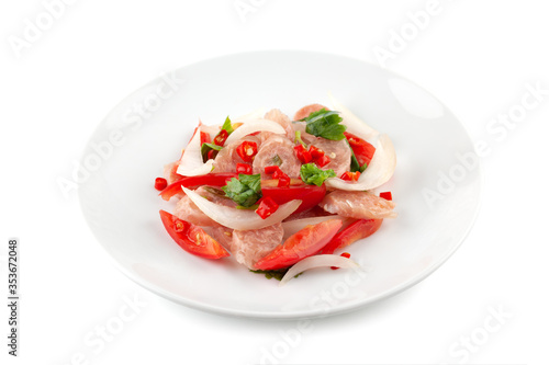 Spicy fermented pork salad on white ceramic plate