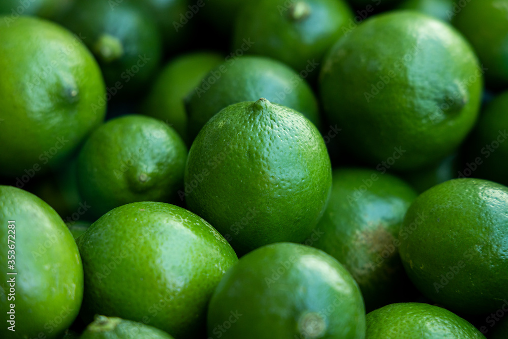 Many green lemons together - healthy citrus fruits Many green lemons together - healthy citrus fruits