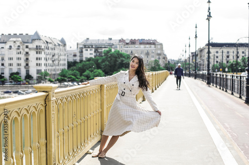 Elegant woman is walking in the city