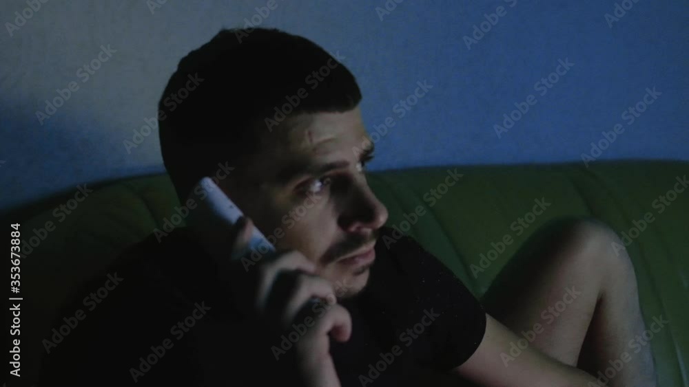 Dissatisfied angry man talking on phone with food pizza delivery courier at night at home in apartment. Nervous unhappy client is arguing with technical support. Poor customer service. Call center Dissatisfied angry man talking on phone with food pizza delivery courier at night at home in apartment. Nervous unhappy client is arguing with technical support. Poor customer service. Call center