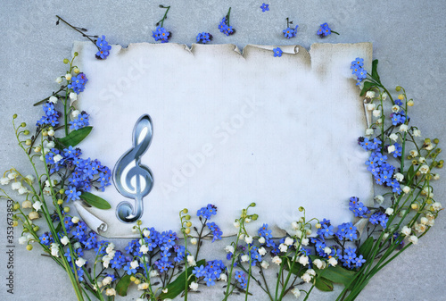 spring flowers on vintage paper with music clef 