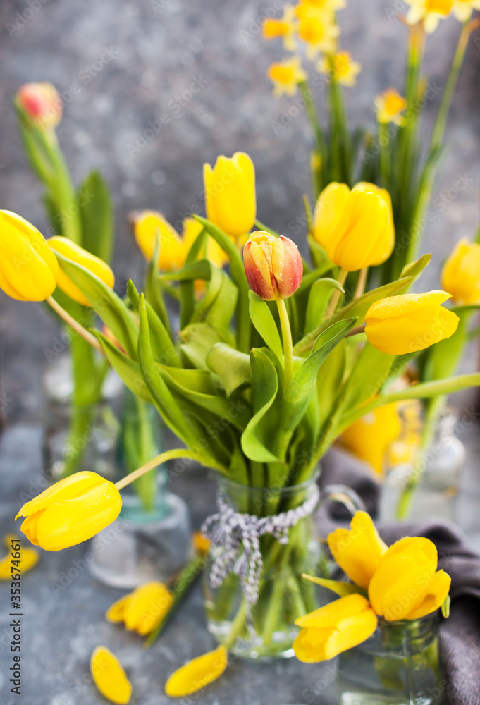 Spring yellow tulips bouquet on gray background Spring yellow tulips bouquet on gray background
