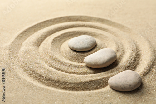 Stones on the sand with patterns. Zen concept